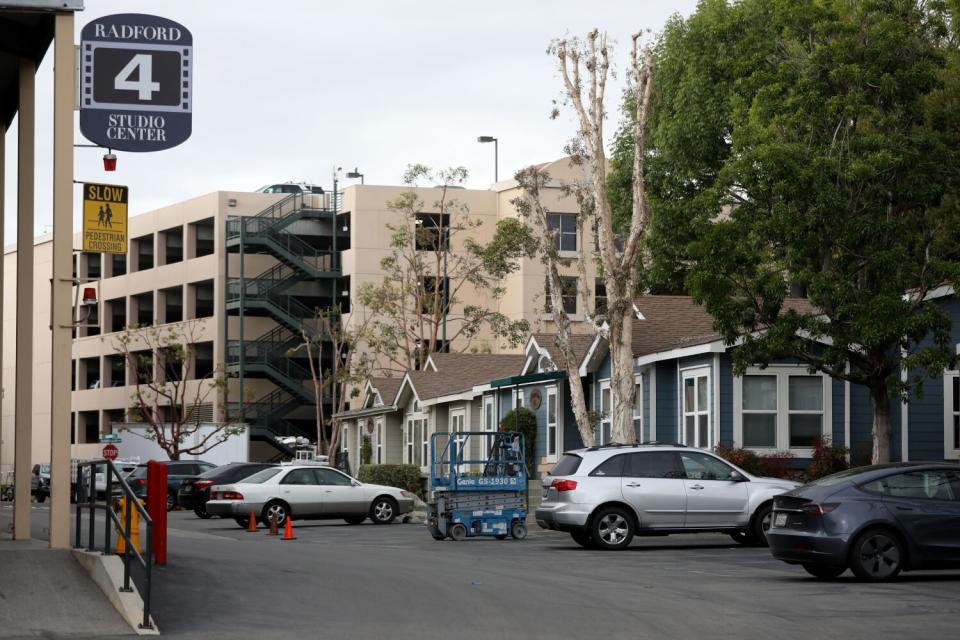 Bungalows, right, and a parking structure in the background.