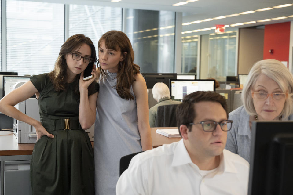 This image released by Universal Pictures shows, from left, Zoe Kazan as Jodi Kantor, Carey Mulligan as Megan Twohey, Davram Stiefler as Rory Tolan, and Patricia Clarkson as Rebecca Corbett in a scene from "She Said." (JoJo Whilden/Universal Pictures via AP)