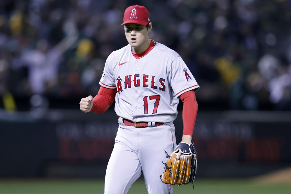 Los Angeles Angels' Shohei Ohtani (17) celebrates after a striking out Oakland Athletics' Jesus Aguilar in the sixth inning of an opening day baseball game in Oakland, Calif., Thursday, March 30, 2023. (AP Photo/Jed Jacobsohn)