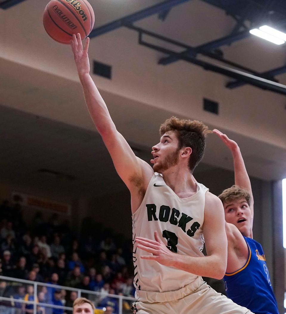 Westfield Shamrocks guard Cam Haffner (3) reaches for a lay-up on Saturday, March. 12, 2022, at Homestead High School in Logansport. Westfield Shamrocks defeated the Homestead Spartans, 64-53.