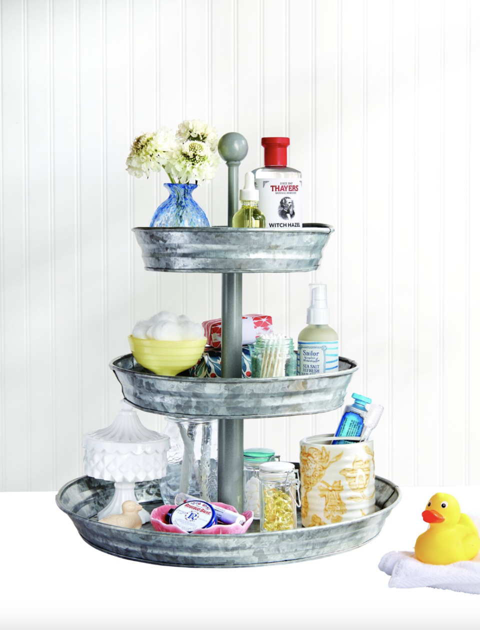 bathroom storage ideas, face products on a three tier stand