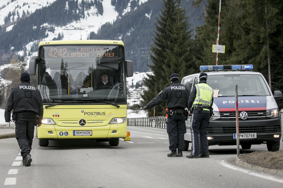 Police at a roadblock stop a bus from driving out of Sankt Anton following the imposition of a quarantine due to a coronavirus outbreak, March 14, 2020, near Landeck, Austria. The ski resort towns of Sankt Anton and Ischgl were both put under quarantine and many ski resorts in the region were closed. / Credit: Jan Hetfleisch/Getty