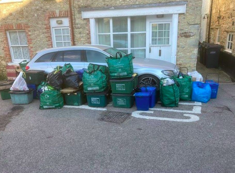 Residents surrounded the car with rubbish bags after it blocked binmen entering their road. (SWNS)