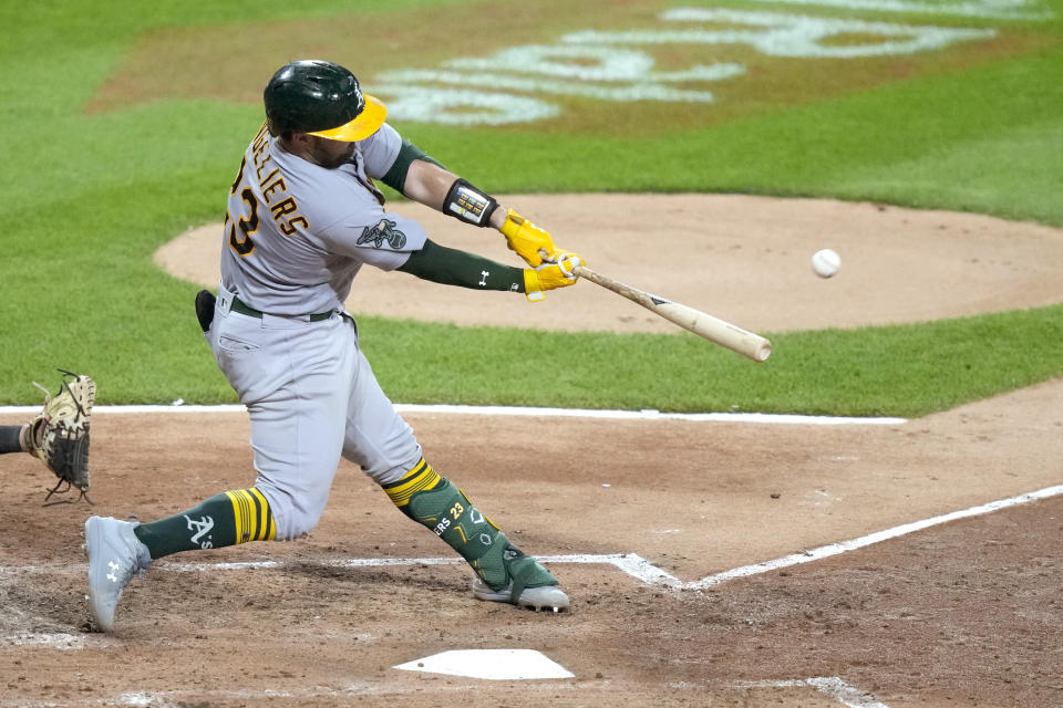 Oakland Athletics' Shea Langeliers hits a two-run home run off Chicago White Sox starting pitcher Jesse Scholtens during the fourth inning of a baseball game Thursday, Aug. 24, 2023, in Chicago. (AP Photo/Charles Rex Arbogast)