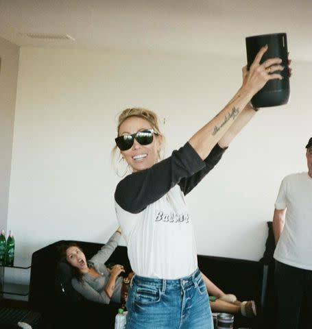 <p>Tish Cyrus Instagram</p> Tish Cyrus with Miley Cyrus in the background