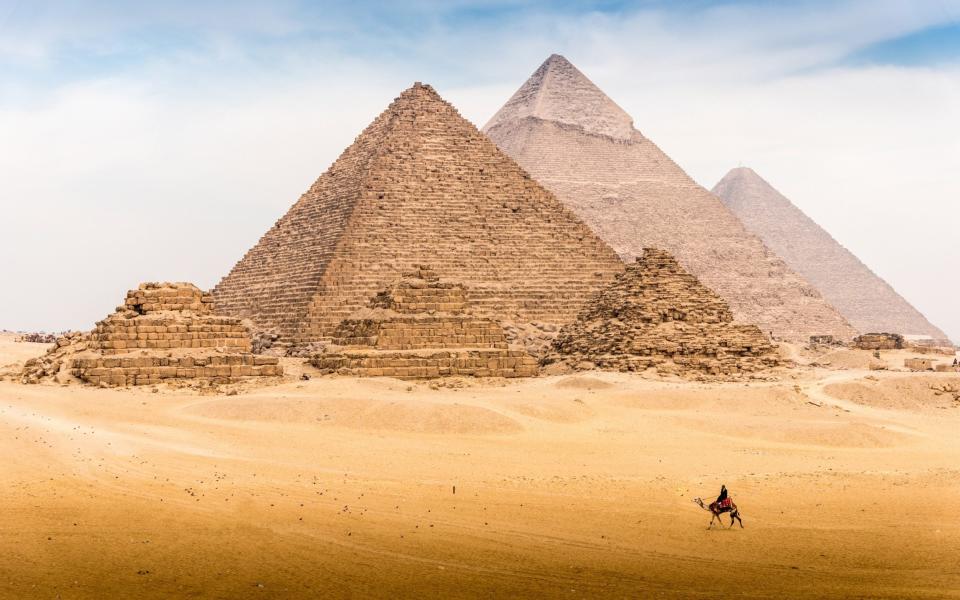 View of Pyramid complex of Giza, in Cairo Egypt - Kitti Boonnitrod/Moment RF