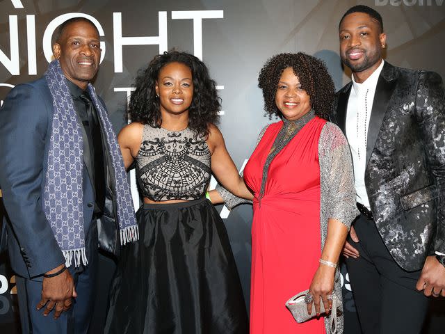 <p>Bobby Metelus/Getty</p> Dwyane Wade with parents Dwyane Wade Sr. and Jolinda Wade alongside sister Tragil Wade on the red carpet at A Night on the Runwade Event on March 19th, 2017.