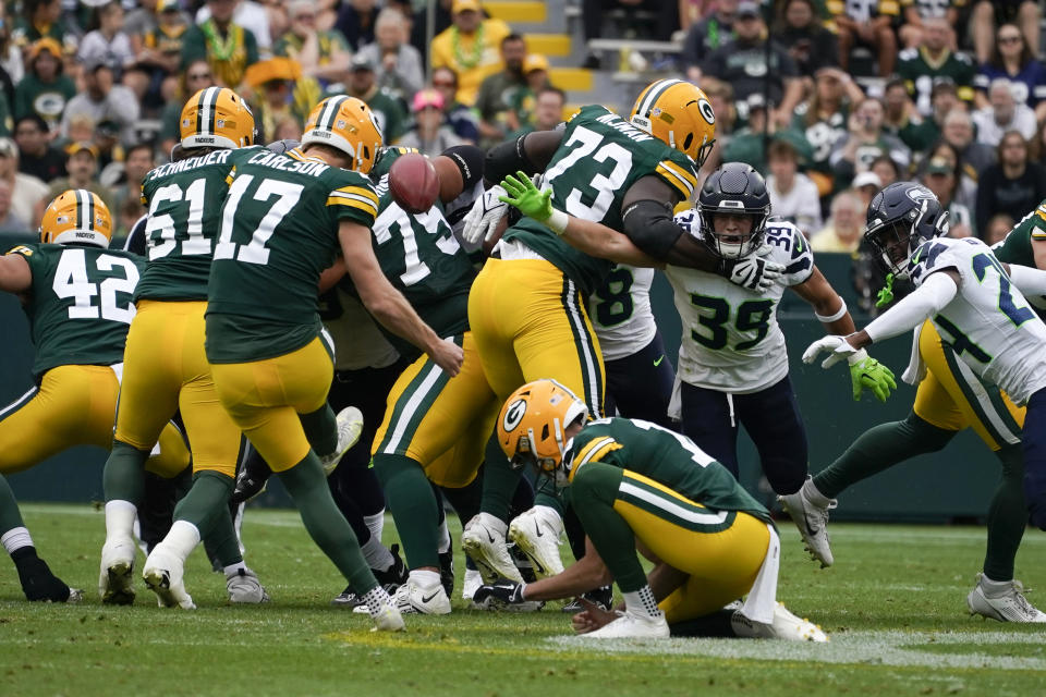 Green Bay Packers place-kicker Anders Carlson (17) kicks a 57-yard field goal in the first half of a preseason NFL football game against the Seattle Seahawks, Saturday, Aug. 26, 2023, in Green Bay, Wis. (AP Photo/Kiichiro Sato)
