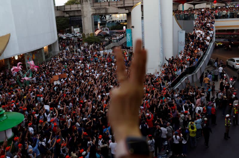 Supporters wave react at a sudden unauthorised rally by the progressive Future Forward Party in Bangkok