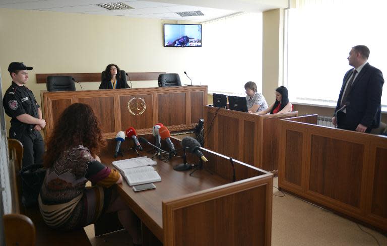 A captured Russian soldier participates via videoconference in a trial in Kiev's district court on May 22, 2015