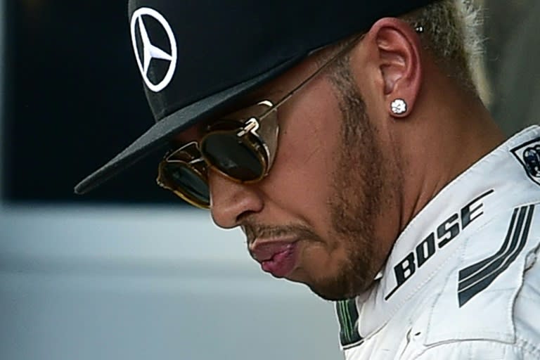 Second placed Mercedes AMG Petronas F1 Team's British driver Lewis Hamilton reacts after the qualifying session of the Russian Formula One Grand Prix at the Sochi Autodrom circuit on October 10, 2015