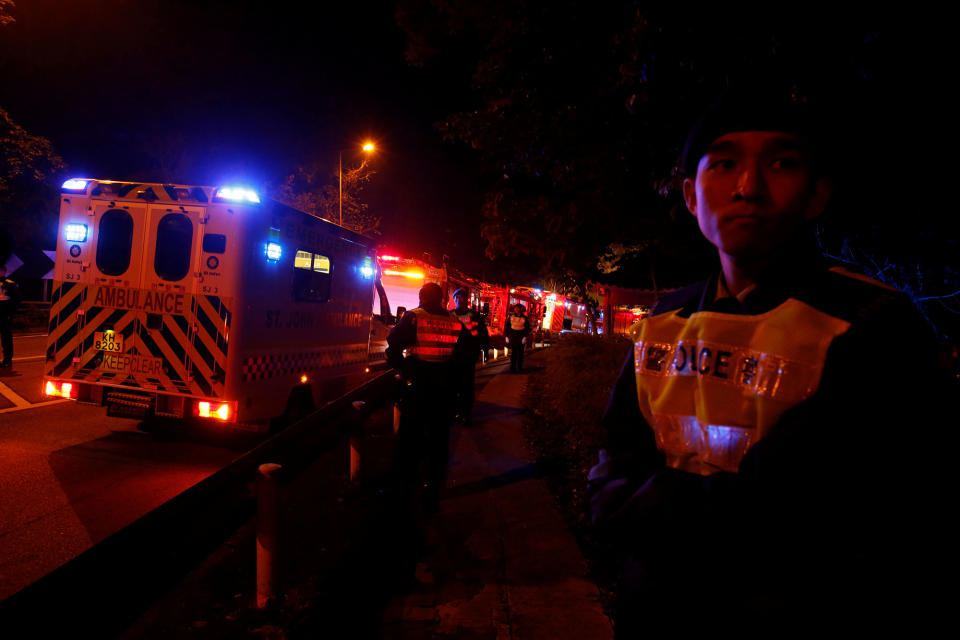 <p>Rescuers arrive after a bus crashed in Hong Kong, China, Feb. 10, 2018. (Photo: Bobby Yip/Reuters) </p>