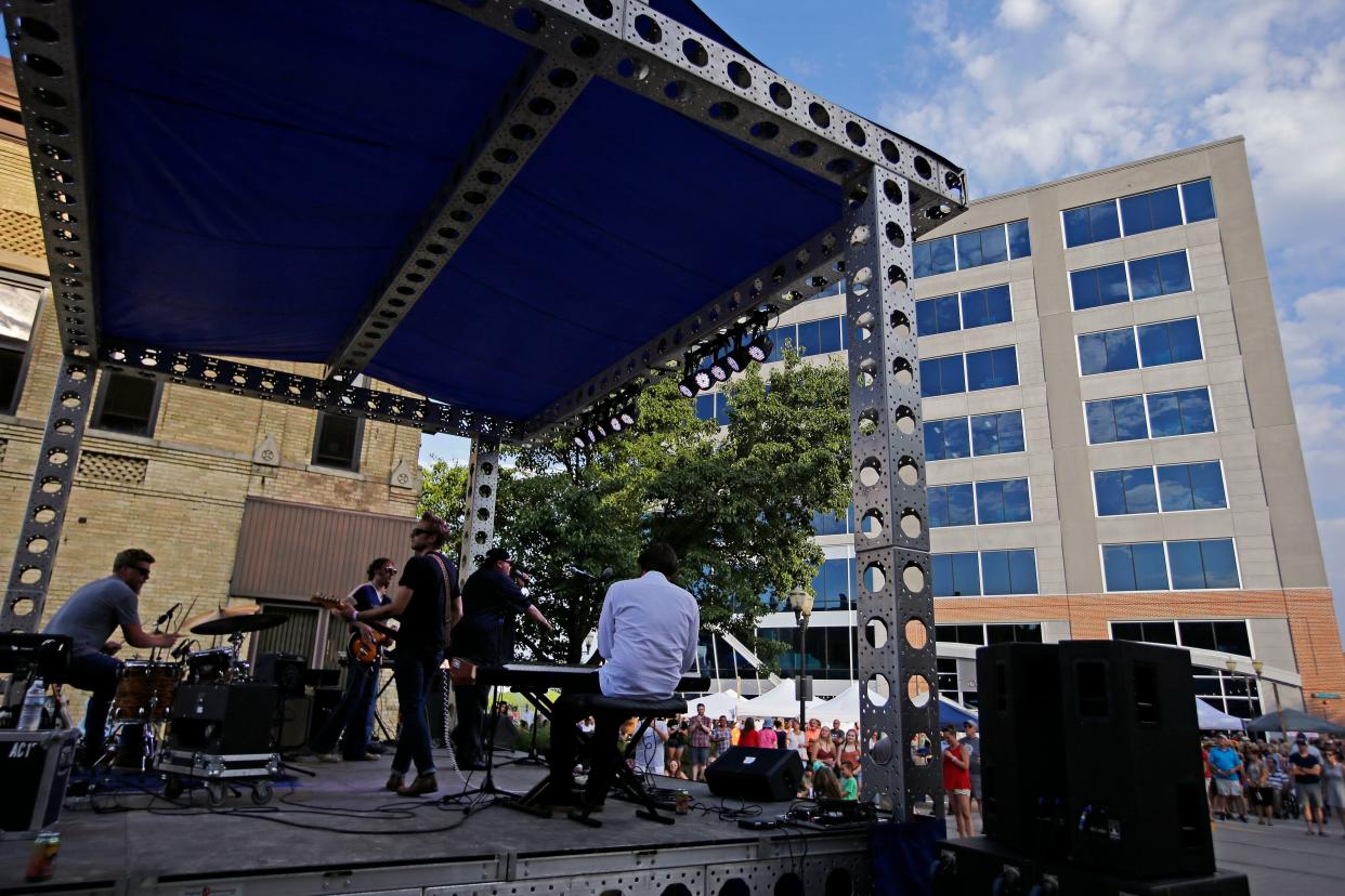 J-Council performs for fans in downtown Menasha at a Bazaar After Dark event.