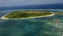 An aerial photo shows Thitu Island, part of the disputed Spratly group of islands, in the South China Sea on July 20, 2011