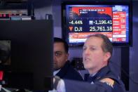 Traders work on the floor at the NYSE in New York