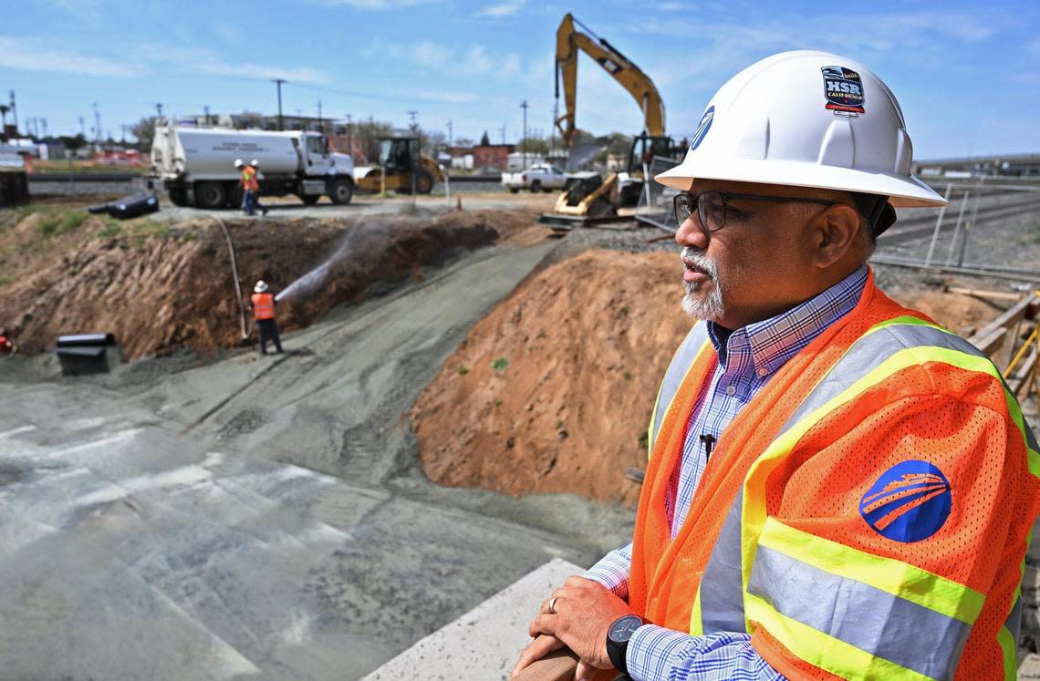 Garth Fernandez, Central Valley regional director for the California High-Speed Rail Authority, looks out over the Tulare Street construction site during a tour of underpasses being built in downtown Fresno on Friday, March 22, 2024.