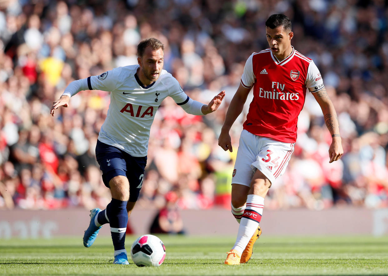 Soccer Football - Premier League - Arsenal v Tottenham Hotspur - Emirates Stadium, London, Britain - September 1, 2019  Tottenham Hotspur's Christian Eriksen in action with Arsenal's Granit Xhaka   REUTERS/David Klein  EDITORIAL USE ONLY. No use with unauthorized audio, video, data, fixture lists, club/league logos or "live" services. Online in-match use limited to 75 images, no video emulation. No use in betting, games or single club/league/player publications.  Please contact your account representative for further details.