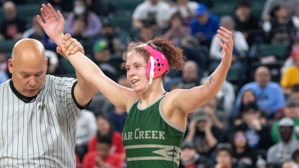 Cedar Creek's Riley Lerner celebrates after defeating Somerville's Valarie Maldonado during the 120 lb. girls championship bout of the NJSIAA individual wrestling championships tournament at Jim Whelan Boardwalk Hall in Atlantic City on Saturday, March 4, 2023. 