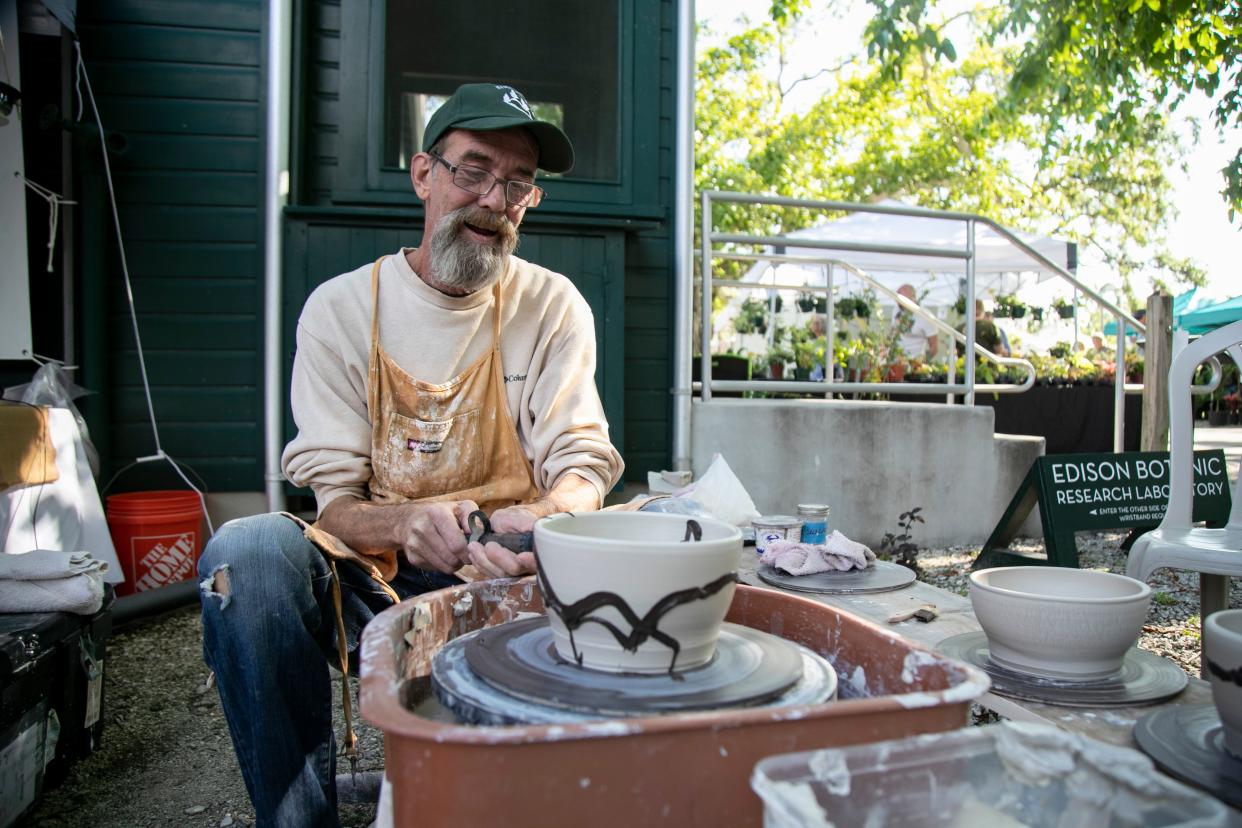 Joseph Mayhew of JM Pottery in Cape Coral finishes a pot on the wheel during the Edison & Ford Winter Estates Garden Festival.