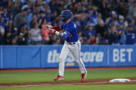 Toronto Blue Jays centre fielder Whit Merrifield rounds the bases after hitting a solo home run in the third inning of a baseball game against the Boston Red Sox in Toronto, Sunday, Oct. 2, 2022. (Cole Burston/The Canadian Press via AP)
