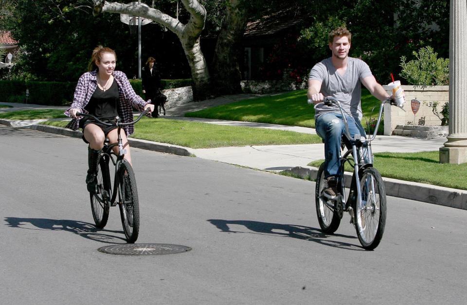 Los Angeles, March 5th 2010 Miley Cyrus takes a bike ride with her boyfriend Liam Hemsworth outside of her home in Toluca Lake, CA.&nbsp;