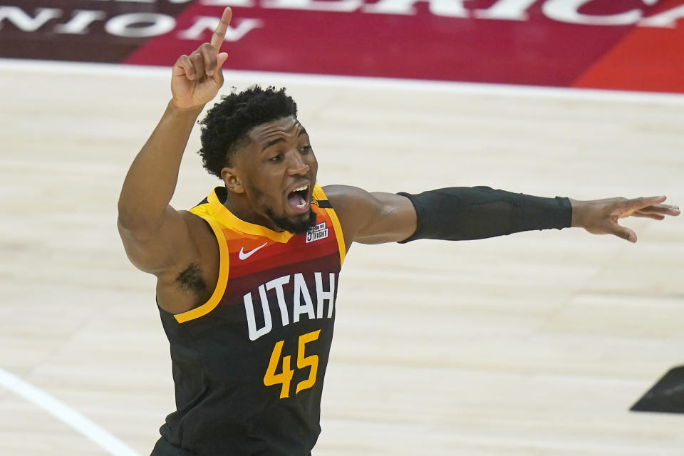 Utah Jazz guard Donovan Mitchell (45) directs his team in the first half during an NBA basketball game against the Chicago Bulls, Friday, April 2, 2021, in Salt Lake City. (AP Photo/Rick Bowmer)