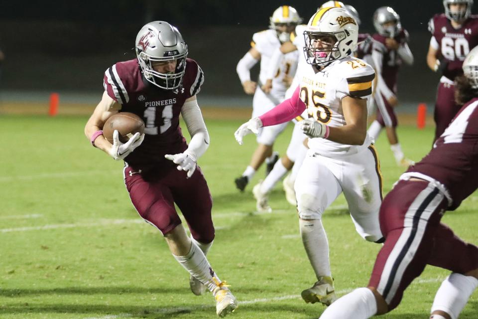 Mt. Whitney's Carter Myers runs downfield against Golden West in an East Yosemite League high school football game at Visalia Community Stadium in Visalia, Calif., Friday, Oct. 7, 2022.
