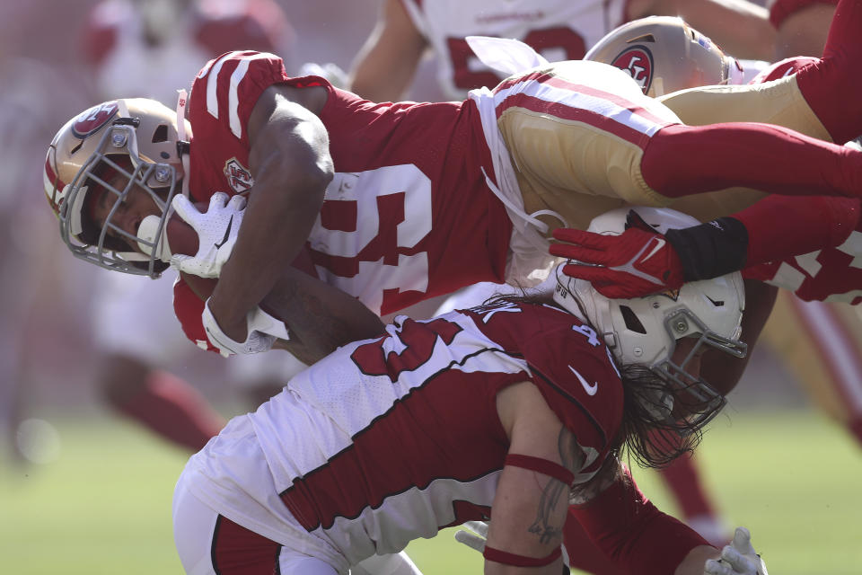 San Francisco 49ers' Trenton Cannon, top, is tackled by Arizona Cardinals' Dennis Gardeck during the first half of an NFL football game in Santa Clara, Calif., Sunday, Nov. 7, 2021. (AP Photo/Jed Jacobsohn)