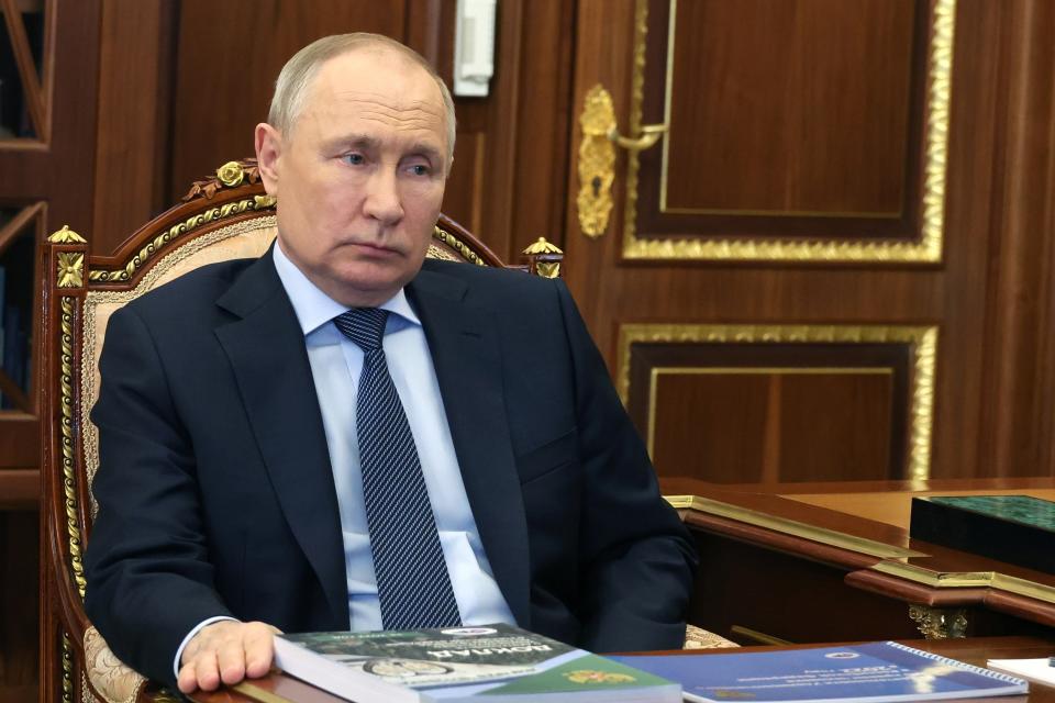 FILE - Russian President Vladimir Putin listens to Russian Human Rights ombudsman Tatyana Moskalkova during their meeting in Moscow, Russia, Monday, May 15, 2023. While the world awaits Ukraine's spring offensive, its leader Volodymyr Zelenskyy has already launched a diplomatic one. In a span of a week, he has dashed to Italy, the Vatican, Germany, France and Britain to shore up support for the defense of his country. Russian President Vladimir Putin, meanwhile, was at home, facing unprecedented international isolation, with an International Criminal Court arrest warrant hanging over his head and clouding the prospects of traveling to many destinations, including those viewed as allies. (Mikhail Klimentyev, Sputnik, Government Pool Photo via AP, File)