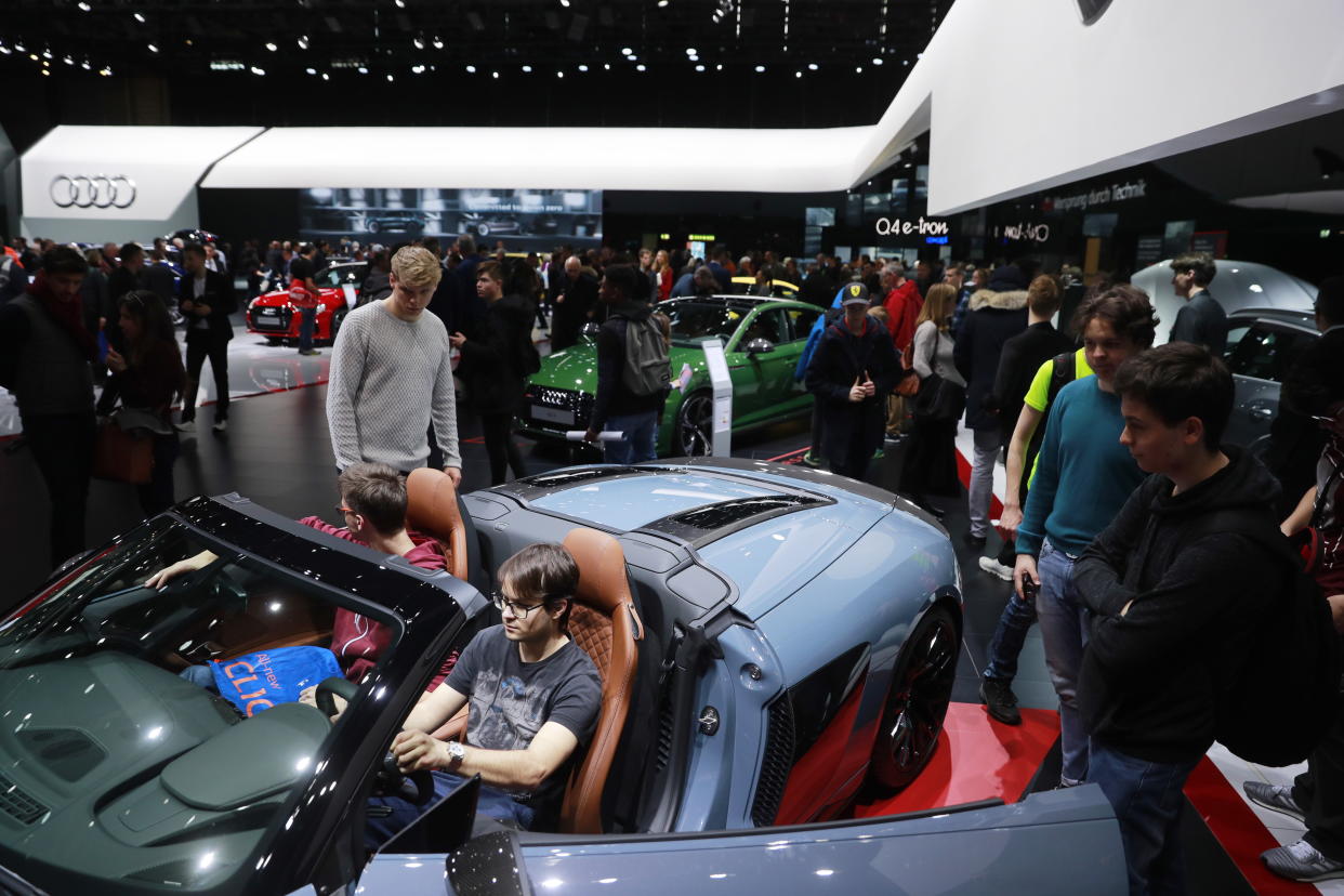 GENEVA, SWITZERLAND - MARCH 7, 2019: People by the Audi AG German automobile manufacturer stand at the 89th Geneva International Motor Show. Sergei Fadeichev/TASS (Photo by Sergei Fadeichev\TASS via Getty Images)