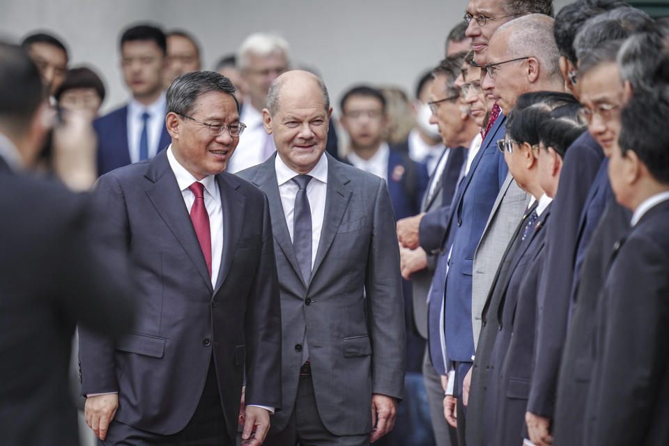 German Chancellor Olaf Scholz, center right, receives Chinese Premier Li Qiang, center left, for the German-Chinese government consultations, in front of the Federal Chancellery in Berlin, Germany, Tuesday June 20, 2023. (Kay Nietfeld/dpa via AP)