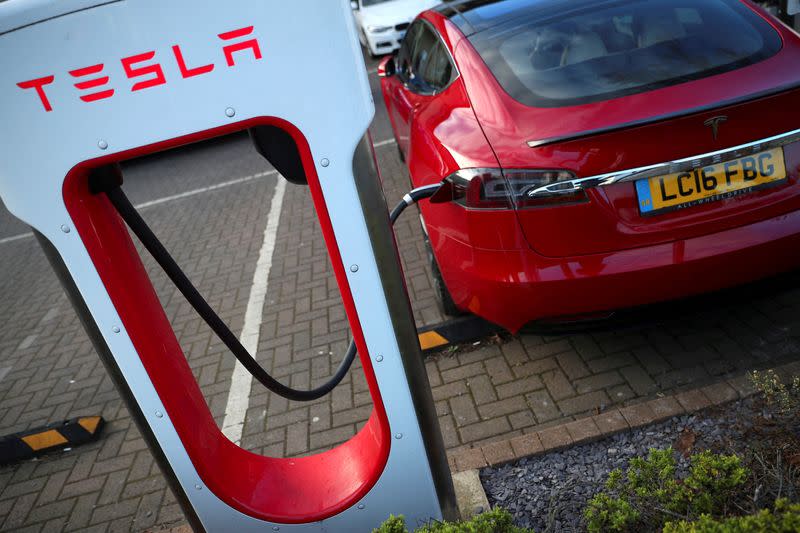 FILE PHOTO: A Tesla car is charged at a Tesla dealership in West Drayton, just outside London