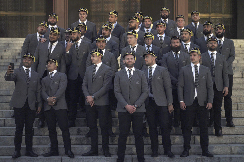 New Zealand All Blacks captain Kieran Read, center, and his teammates pose for a group photo after the team's welcome ceremony of the Rugby World Cup 2019 at Zojoji temple in Tokyo Saturday, Sept. 14, 2019. Rugby World Cup will start from Sept. 20 in Japan. (AP Photo/Eugene Hoshiko)