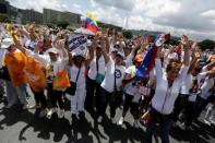 Opposition supporters shout slogans as they take part in a rally to demand a referendum to remove Venezuela's President Nicolas Maduro in Caracas, Venezuela October 22, 2016. REUTERS/Marco Bello