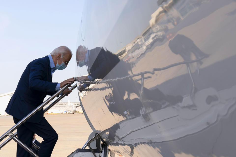 Democratic presidential candidate former Vice President Joe Biden ducks his head as he boards a plane at Harrisburg International Airport in Middletown, Pa., Monday, Sept. 7, 2020. (AP Photo/Carolyn Kaster)