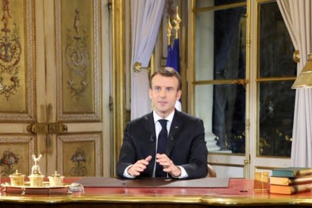 French President Emmanuel Macron speaks during a special address to the nation, his first public comments after four weeks of nationwide 'yellow vest' (gilet jaune) protests, at the Elysee Palace, in Paris, France December 10, 2018. Picture taken December 10, 2018. Ludovic Marin/Pool via REUTERS