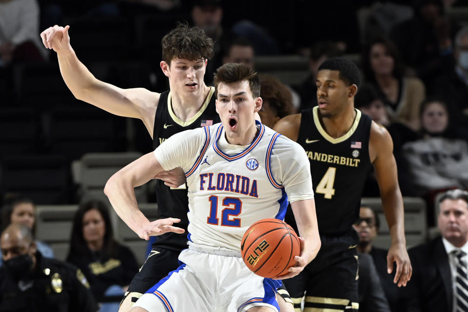 FILE - Florida forward Colin Castleton (12) plays against Vanderbilt during the first half of an NCAA college basketball game Tuesday, March 1, 2022, in Nashville, Tenn. Castleton, a first-team preseason All-SEC selection, is back after missing part of last season with a separated left shoulder. (AP Photo/Mark Zaleski, File)