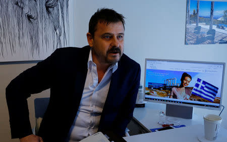 Real estate agent Cenk Tanman talks during an interview with Reuters at his office in Istanbul, Turkey, March 28, 2017. Picture taken March 28, 2017. REUTERS/Murad Sezer