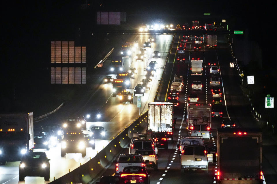 Motor vehicles move along Interstate 276 in Feasterville, Pa., Thursday, Dec. 21, 2023. (AP Photo/Matt Rourke)