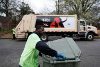 Sanitation worker Walter Coleman works a route on a truck decorated to commemorate the 50th anniversary of Martin Luther King Jr.'s assassination in Memphis, Tennessee, U.S., March 28, 2018. King Jr. was shot and killed while rallying with striking sanitation workers in 1968. REUTERS/Jonathan Ernst