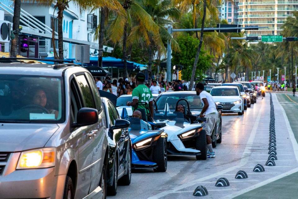 Motorists wait in traffic on Ocean Drive during the first day of Memorial Day Weekend in Miami Beach, Florida, on Friday, May 27, 2022.