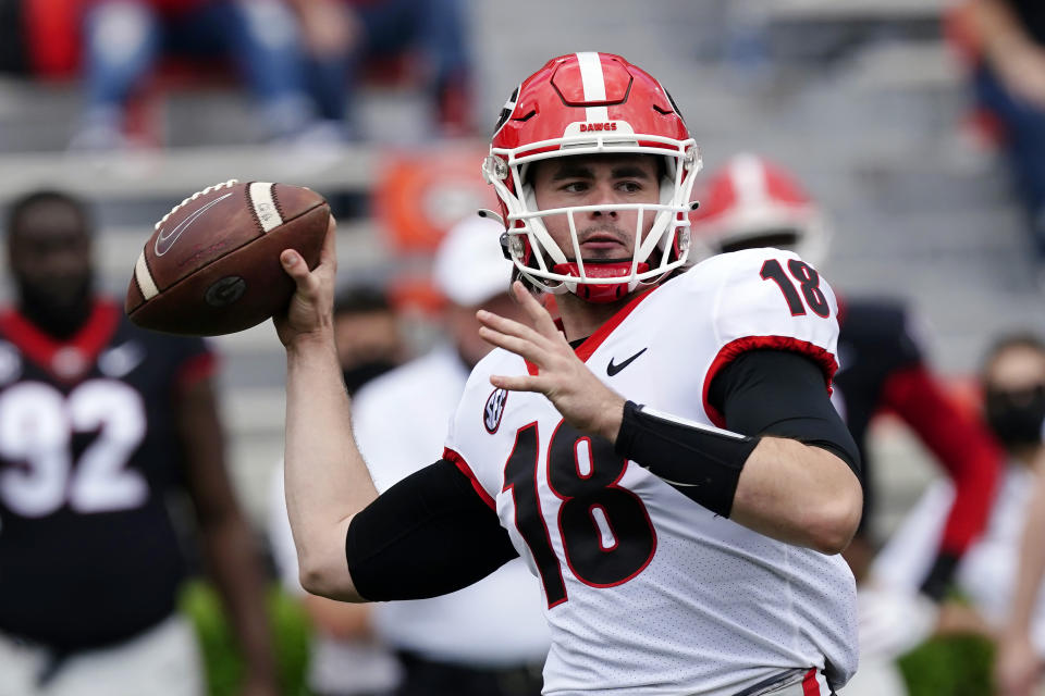 FILE - In this April 17, 2021, file photo, Georgia quarterback JT Daniels (18) throws a pass during their spring NCAA college football spring game in Athens, Ga.. (AP Photo/John Bazemore, File)