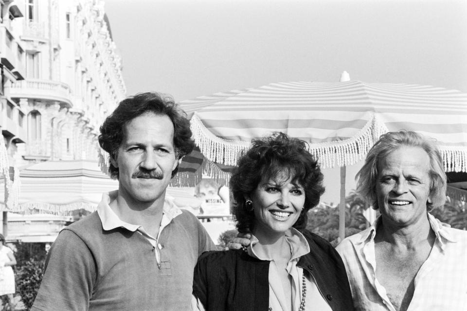 (From L) German film director Werner Herzog, Italian actress Claudia Cardinale and German actor Klaus Kinski pose during the photocall of "Fitzcarraldo" during the 35th International Film Festival in Cannes, on May 21, 1982.