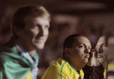 Brazil fans react after their team lost to Paraguay in a penalty shootout during their Copa America 2015 quarter-finals soccer match at Estadio Municipal Alcaldesa Ester Roa Rebolledo in Concepcion, Chile, June 27, 2015. REUTERS/Jose Luis Saavedra