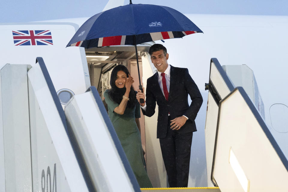 Britain's Prime Minister Rishi Sunak, right, and his wife Akshata Murty arrive by plane in Hiroshima after their visit to Tokyo, ahead of the G-7 Summit in Japan, Thursday May 18, 2023. (Stefan Rousseau/Pool Photo via AP)