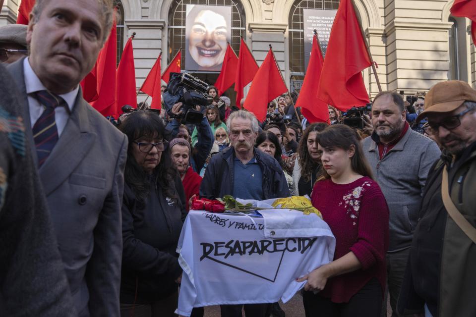 Relatives of prisoners disappeared carry the coffin that contains the remains of Amelia Sanjurjo during her funeral service at the University of the Republic, in Montevideo, Uruguay, Thursday, June 6, 2024. The Uruguayan Prosecutor’s Office confirmed that the human remains found in June 2023 at the 14th Battalion of the Uruguayan Army belong to Sanjurjo, a victim of the 1973-1985 dictatorship who was 41 years old and pregnant at the time of her disappearance. (AP Photo/Matilde Campodonico)