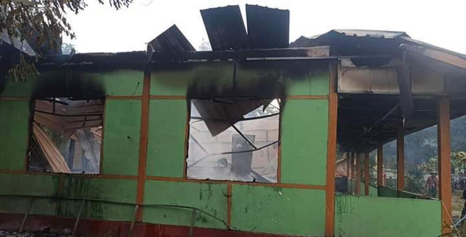 The wall of a school structure is left standing after it was burned in Taung Myint village in the Magway region of Myanmar on Sunday, Oct. 16, 2022. Villagers say the decapitated body of a high school teacher was left on grotesque display at a school in rural Myanmar after he was detained and killed by the military. Many similar abuses have been alleged as the army tries to crush opposition to military rule. (AP Photo)