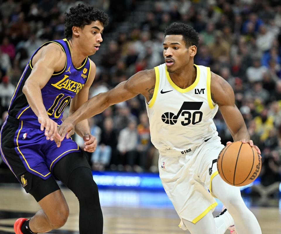 Los Angeles Lakers guard <a class="link " href="https://sports.yahoo.com/nba/players/6725" data-i13n="sec:content-canvas;subsec:anchor_text;elm:context_link" data-ylk="slk:Max Christie;sec:content-canvas;subsec:anchor_text;elm:context_link;itc:0">Max Christie</a> (10) defends Utah Jazz guard Ochai Agbaji (30) as Utah and Los Angeles play at the Delta Center in Salt Lake City on Saturday, Jan. 13, 2024. | Scott G Winterton, Deseret News