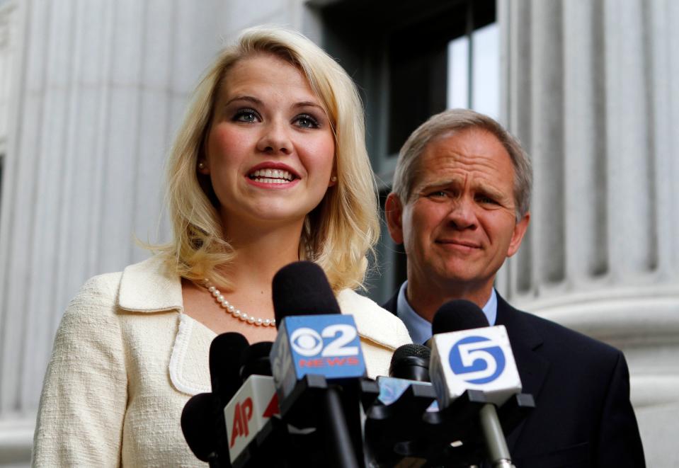 Elizabeth Smart and her father Ed Smart talk to the media in front of the federal courthouse in 2011 in Salt Lake City.