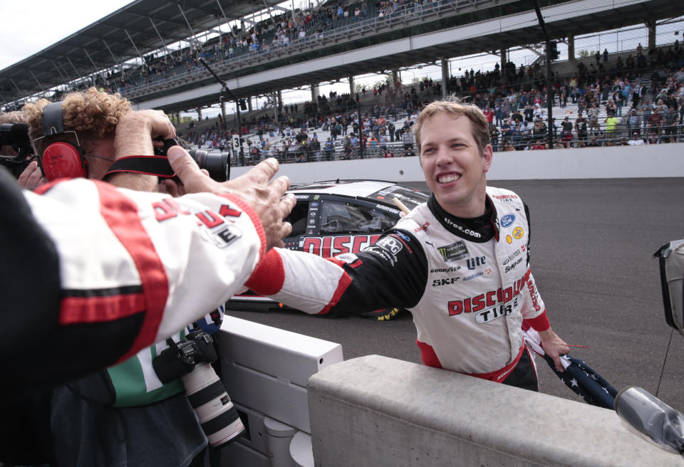 Brad Keselowski celebrates after winning the NASCAR Brickyard 400 auto race at Indianapolis Motor Speedway in Indianapolis, Monday, Sept. 10, 2018. (AP Photo/AJ Mast)